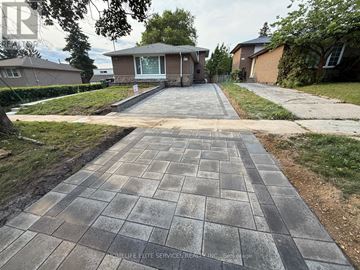 Toronto (Agincourt South-Malvern West) apartment for rent - A driveway with a brick pattern leading to a house.