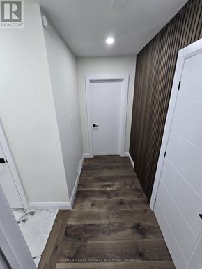 Toronto (Agincourt South-Malvern West) apartment for rent - A hallway with wooden floors and white walls.