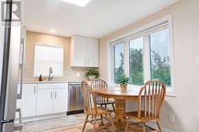 St. Catharines (Western Hill) apartment for rent - A dining room with a wooden table and chairs.