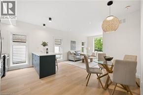 Kitchener apartment for rent - A well-lit, modern living room with a dining area and a kitchenette.