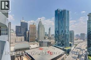 Toronto (Waterfront Communities) condo for rent - A cityscape with a large blue building in the foreground and the words "HOMELIFE NEW WORLD REALTY INC." on the bottom.