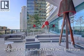 Toronto (Waterfront Communities) condo for rent - A modern outdoor seating area with a view of the cityscape.
