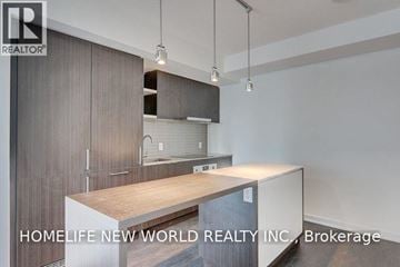 Toronto (Waterfront Communities) condo for rent - A modern kitchen with a wooden countertop and cabinets.