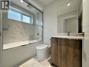 Vancouver apartment for rent - A modern bathroom with a wooden vanity and a walk-in shower.
