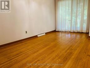 Toronto (Willowdale East) apartment for rent - A room with wooden flooring and a window with curtains.
