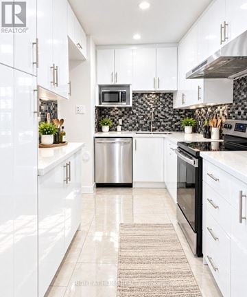 Toronto (Pleasant View) townhouse for rent - A modern kitchen with white cabinets and a stainless steel dishwasher.