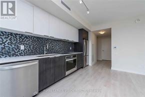 Toronto (Flemingdon Park) condo for rent - A modern kitchen with a tile backsplash and stainless steel appliances.
