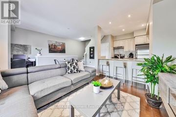 Grimsby (Grimsby Beach) townhouse for rent - A modern living room with a grey sofa and a coffee table.