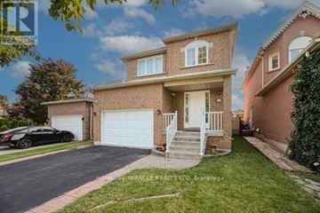 Brampton (Fletcher's West) apartment for rent - A two-story house with a garage and a car parked in front.
