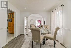 Brampton (Fletcher's West) apartment for rent - A dining room with a table set for two and a chandelier hanging from the ceiling.