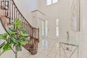 Brampton (Fletcher's West) apartment for rent - A house interior with a staircase and a glass table.
