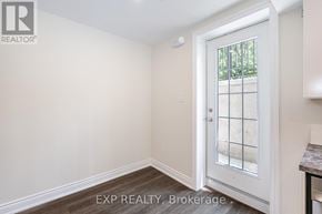 Brampton (Northwest Brampton) apartment for rent - A white door with a glass window is in a room with white walls.