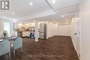 Brampton (Northwest Brampton) apartment for rent - A well-lit kitchen with a dining table and chairs in a house.