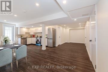 Brampton (Northwest Brampton) apartment for rent - A well-lit kitchen with a dining table and chairs in a house.