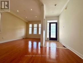 Aurora (Bayview Wellington) apartment for rent - A spacious room with wooden floors and a black door.