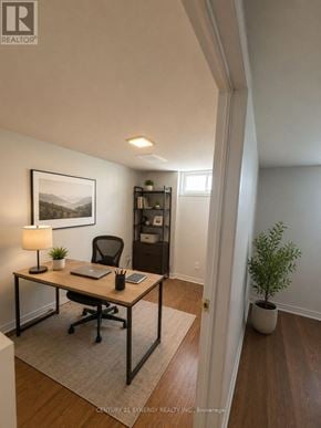 Ottawa townhouse for rent - A room with a desk, chair, and a plant.