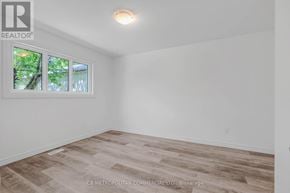 Toronto (Woburn) apartment for rent - A room with a window and wooden flooring.