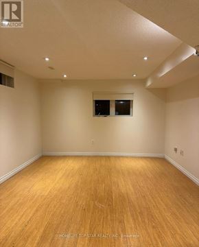 Toronto (Clairlea-Birchmount) apartment for rent - A room with wooden flooring and a window.