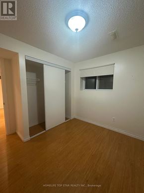 Toronto (Clairlea-Birchmount) apartment for rent - A room with a sliding door and a window.