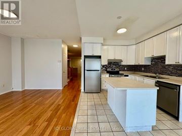 Markham (Greensborough) apartment for rent - A kitchen with white cabinets and a wooden floor.