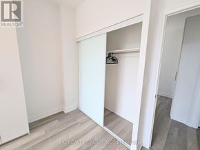 Markham (Grandview) condo for rent - A white closet with a mirror and a hanger.