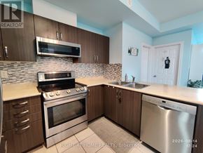 Oakville (Wm Westmount) townhouse for rent - A kitchen with a stove, oven, and sink.