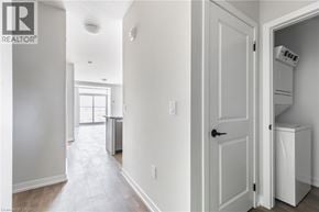 Hamilton apartment for rent - A white room with a door and a washing machine in it.