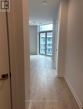 Oakville (Ga Glen Abbey) condo for rent - A hallway with a door leading to a balcony.