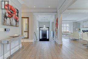 Toronto (Willowdale West) apartment for rent - A spacious living room with a fireplace and a painting on the wall.