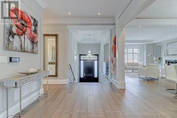 Toronto (Willowdale West) apartment for rent - A spacious living room with a fireplace and a painting on the wall.