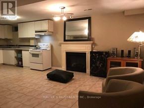 Mississauga (Erindale) apartment for rent - A living room with a fireplace and a television.