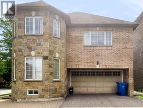 Newmarket (Woodland Hill) apartment for rent - A brick house with a garage door and a window.