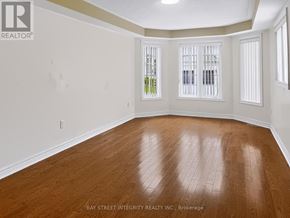 Newmarket (Woodland Hill) apartment for rent - A room with wooden flooring and white walls.