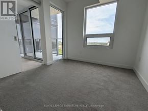 Toronto (Humber Heights) condo for rent - A room with a carpet floor and a window showing a view of the sky.