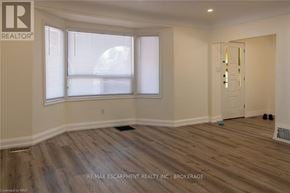 Hamilton (Inch Park) multi-family for rent - A room with a window and a door is on the market.