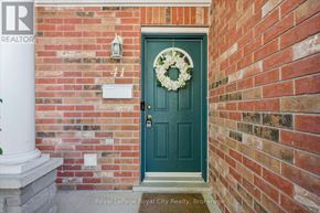 Guelph (Pineridge/Westminster Woods) townhouse for rent - A hallway with a staircase and a mirror on the wall.
