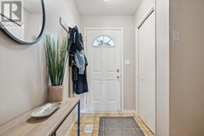 Guelph (Pineridge/Westminster Woods) townhouse for rent - A living room with a couch, chair, and television.