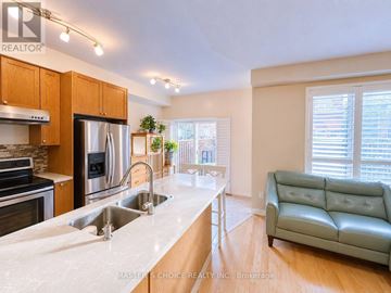 Mississauga (East Credit) apartment for rent - A kitchen with a sink and a couch.