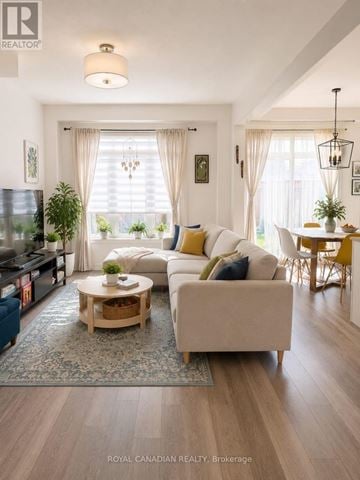 Clarington (Bowmanville) townhouse for rent - A living room with a white couch and a coffee table.