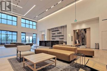 Toronto (Downsview-Roding-Cfb) condo for rent - A modern living room with a large sectional sofa and a coffee table.