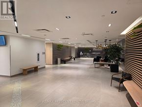 Toronto (Downsview-Roding-Cfb) condo for rent - A modern office lobby with a reception desk and seating area.