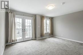 Welland (Lincoln/Crowland) apartment for rent - A room with a carpeted floor and two windows with curtains.