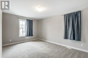 Welland (Lincoln/Crowland) apartment for rent - A spacious room with a window and grey curtains.