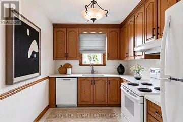 Toronto (Danforth) apartment for rent - A kitchen with wooden cabinets and a white dishwasher.