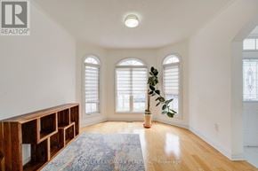 Markham (Wismer) apartment for rent - A room with a large rug and a wooden shelf.