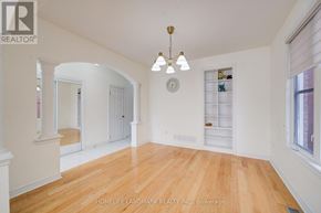 Markham (Wismer) apartment for rent - A large, empty room with wooden floors and white walls.