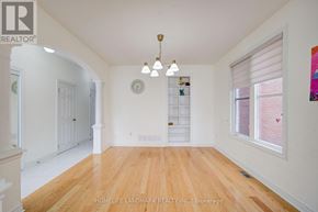 Markham (Wismer) apartment for rent - A large, empty room with wooden floors and white walls.