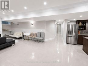 Toronto (Willowdale West) apartment for rent - A spacious living room with a kitchen area in the background.