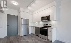 Whitby (Pringle Creek) condo for rent - A kitchen with a refrigerator, oven, and microwave.