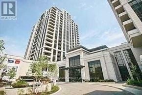 Toronto (Willowdale East) condo for rent - A tall building with a glass facade is the main focus of the image.